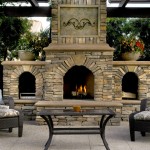 three firebox large outdoor fireplace with lounging chairs and table in front of it