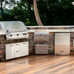 large outdoor kitchen with stainless steel appliances and grill