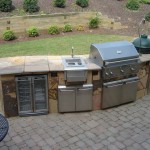 Patio grill kitchen space with large grill and big green egg