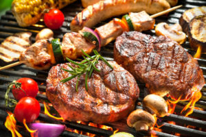 meat and vegetables on the grill